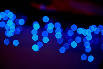 Abstract texture with light bokeh and black background