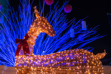 Decorated Reindeer installation illuminated with light during Christmas