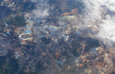view of the city and the earth from the height of a flying plane