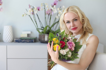 young positive girl with a bouquet of flowers