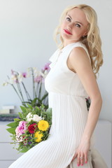 young positive girl with a bouquet of flowers