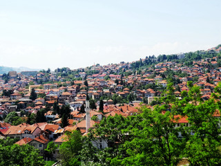 Fototapeta na wymiar Landscape and countryside of cityscape in Sarajevo besides mountains in summer. Sarajevo is the capital city and the administrative center of Federation of Bosnia and Herzegovina.