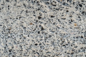 Photo of concrete wall with crack surface.