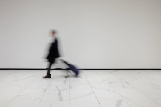 Isolated Blurred Person With Trolley