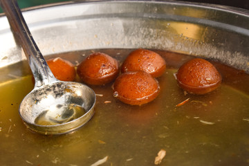 Hot gulab jamun in sugar syrup