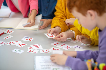 Pupils learning English alphabet at elementary school