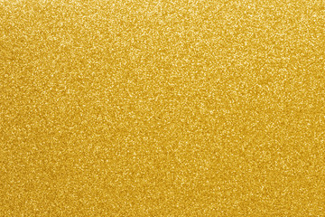 Gold glitter texture background. Shiny defocused golden sparkle lights