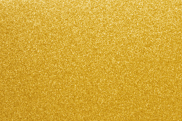 Gold glitter texture background. Shiny defocused golden sparkle lights