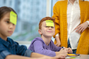 Little boy being happy playing words game