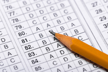 testing in exercise and exam paper. computer sheet with pencil in school test room, education concept