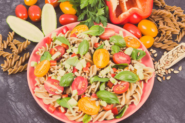 Fresh salad with pasta and vegetables. Best food for dieting and slimming. Vintage photo