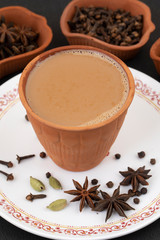 Indian Popular Drink Masala Chai or Masala Tea With Traditional Beverage on Black Background