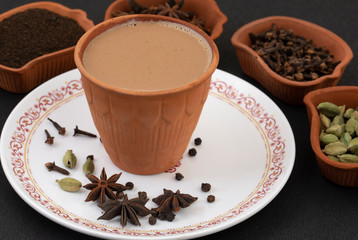 Indian Popular Drink Masala Chai or Masala Tea With Traditional Beverage on Black Background