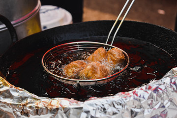 frying momo in hot oil