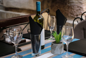 Served table in a summer cafe on a street in the old part of the tower Kotor, Montenegro.