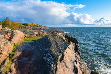 Finland. Northern nature. Skerries of Finland. Seascape Finland landscape with sea waves. Stones on the shore of the Baltic Sea. Nature of Europe. Holidays in the European Union. Trip to Scandinavia.