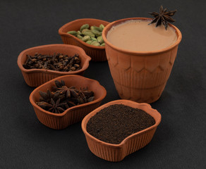 Indian Popular Drink Masala Chai or Masala Tea With Traditional Beverage on Black Background