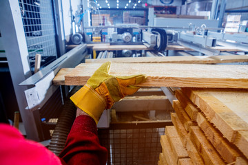 Carpenter with fibreboards at furniture factory workshop. Woodworking industry