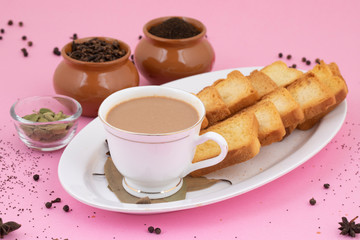 Indian Popular Drink Masala Chai or Masala Tea With Traditional Beverage on Pink Background