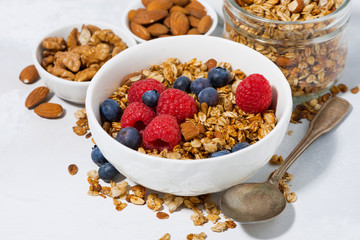 cottage cheese with granola and fresh berries for breakfast, closeup
