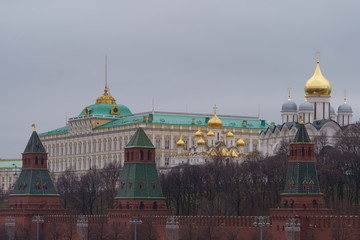 Moscow downtown cityscape. Kremlin Towers, the Residence of the President of Russian Federation, Ivan the Great Bell Tower, Dormition Cathedral in overcast winter day