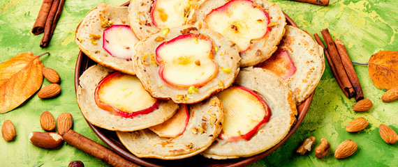 Fried pancakes with apples