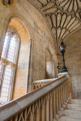 Beautiful gothic stone staircase in Christ Church (Oxford, University, England, UK). July 2019. This place was seen in the Harry Potter series (Hogwarts movie set). Unique european architecture.