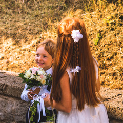 Naklejka premium Ring bearer and flower girl at summer wedding in Italy.