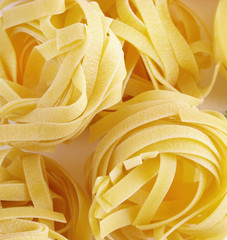 Tagliatelle pasta on a wooden table