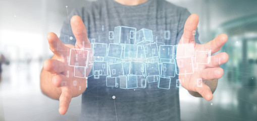 Businessman holding a Cloud of blockchain cube and binary data 3d rendering