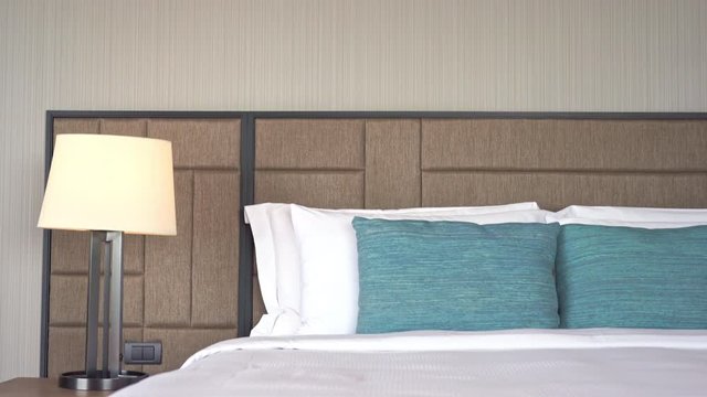 Tilt-down from headboard to luxury resort hotel bed.