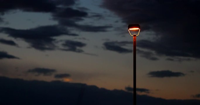 Single Phosphor Street Light During Sunset at Airport