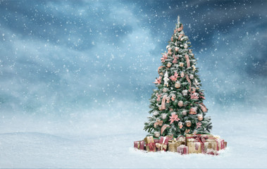 Beautiful christmas tree with golden and red present boxes in a snowy winter landscape