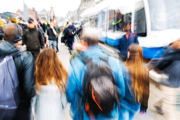 crowd of people in the city with motion blur