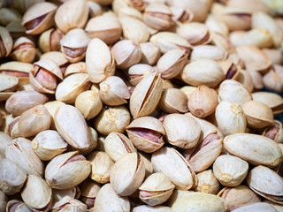 Bunch of pistachios close-up. Nuts, pistachios as texture