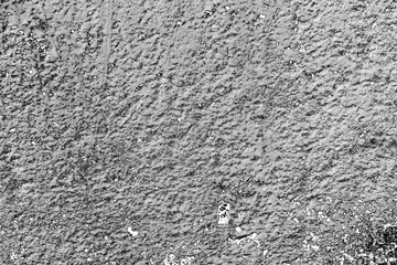Texture of a concrete wall with cracks and scratches which can be used as a background