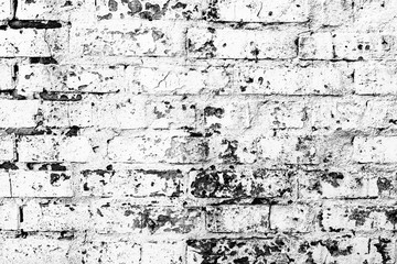 Texture of a brick wall with cracks and scratches which can be used as a background