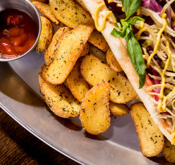 Hotdogs and French fries on a dishes. Fast food meal. Restaurant.