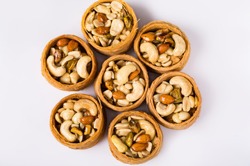 Oriental sweets, baklava, Turkish delight with almonds, cashews and pistachios on plates.