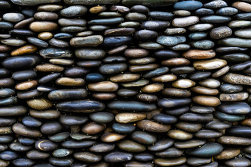 Background of colored sea pebbles side view