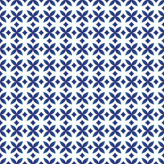 Diamond seamless geometric pattern. Decorative blue diamonds and flowers on isolated white background. Design for porcelain, ceiling, texture, paper, wall, background.