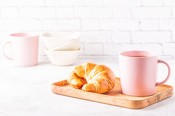 French croissants and cup of coffee.