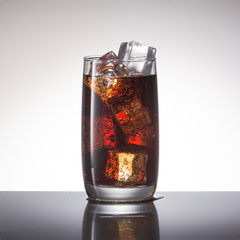 Cola with ice, close-up. Soft non-alcoholic cocktail