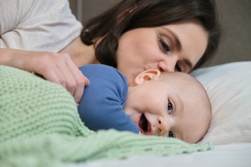 Portrait of beautiful young mother and her baby 7 month old son