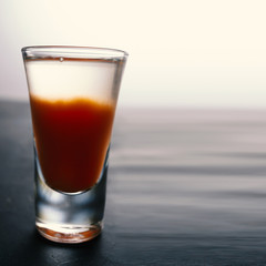 Bloody mary cocktail on a concrete dark table