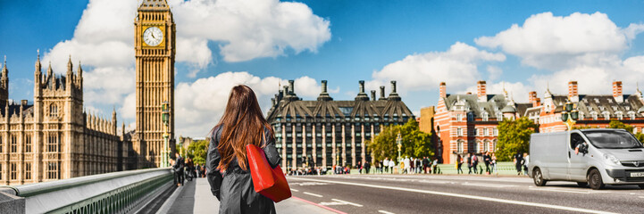 London city commuters walking by Westminster Big Ben people lifestyle. Tourist woman commuting in...