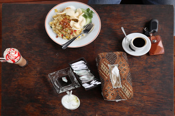 Obraz na płótnie Canvas Fried rice, frappucino, espresso, foods on table top view