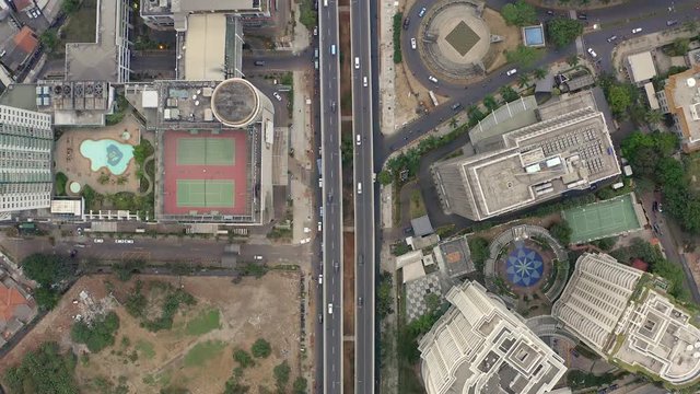Top Down Aerial Aerial drone  view of Jakarta city skyscrapers during the afternoon under cloudy day. Wide shot on 4K DJI Mavic 2