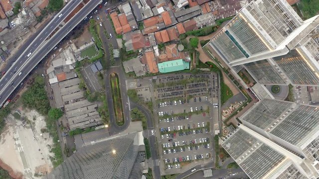 Top Down Aerial Aerial drone  view of Jakarta city skyscrapers during the afternoon under cloudy day. Wide shot on 4K DJI Mavic 2