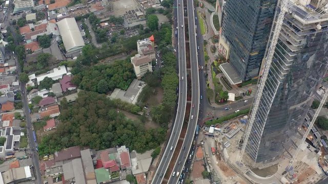 Top Down Aerial Aerial drone  view of Jakarta city skyscrapers during the afternoon under cloudy day. Wide shot on 4K DJI Mavic 2